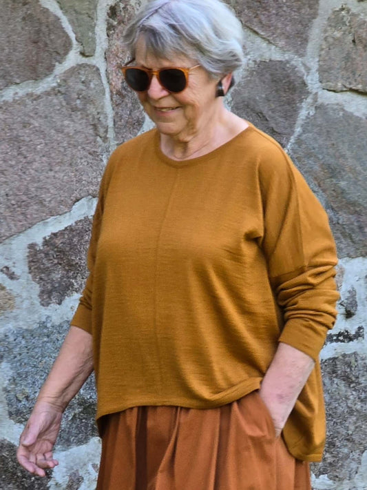 Elegant, kobberfarvet strik